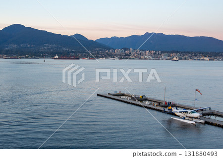 Seaplane moored at the harbor and cityscape Seaplane moored at the harbor and cityscape 131880493