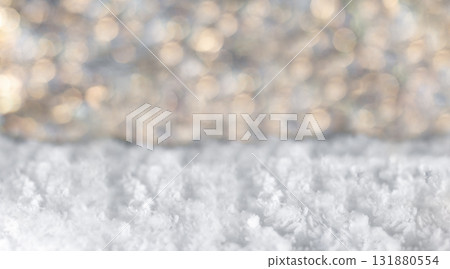 Snowy foreground with soft bokeh lights in the background, a tranquil winter scene Snowy foreground with soft bokeh lights in the background, a tranquil winter scene 131880554