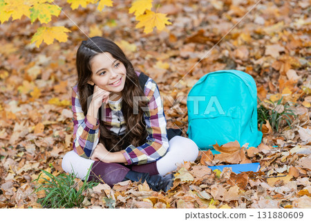 Education for adolescence. Teen girl in autumn park outdoor. Autumn time to study. Knowledge and education. School education. Student life. Back to school. Autumn girl with school bag. Relax time 131880609