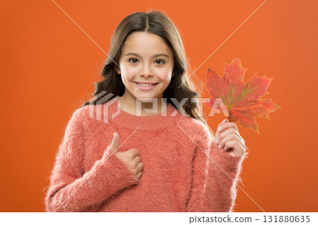 Maple syrup is often used as condiment for pancakes waffles oatmeal or porridge. Ingredient in baking and sweetener. Maple syrup. Little child hold maple leaf. Small girl smiling with maple leaf Maple syrup is often used as condiment for pancakes waffles oatmeal or porridge. Ingredient in baking and sweetener. Maple syrup. Little child hold maple leaf. Small girl smiling with maple leaf 131880635