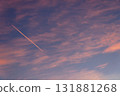 A contrail of streaks in the crimson cloud sky 131881268
