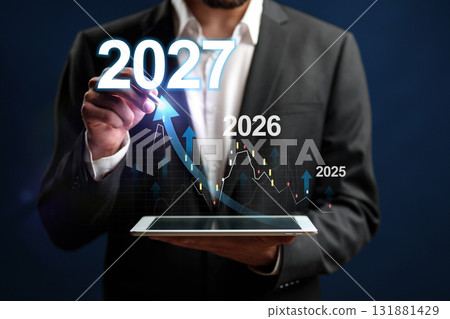 Businessman analyzing growth projections for future years in a modern setting 131881429