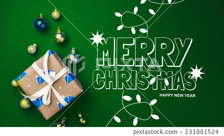 Festive Christmas gift with colorful decorations on a green background Festive Christmas gift with colorful decorations on a green background 131881524