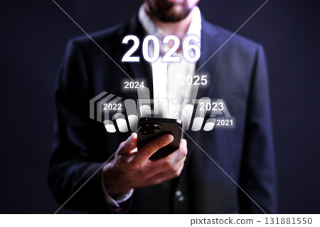 Future planning with a smartphone in a formal setting, focused on upcoming years Future planning with a smartphone in a formal setting, focused on upcoming years 131881550