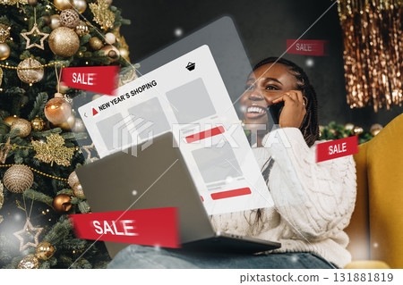 Woman enjoying holiday shopping while sitting on the floor surrounded by Christmas decorations Woman enjoying holiday shopping while sitting on the floor surrounded by Christmas decorations 131881819