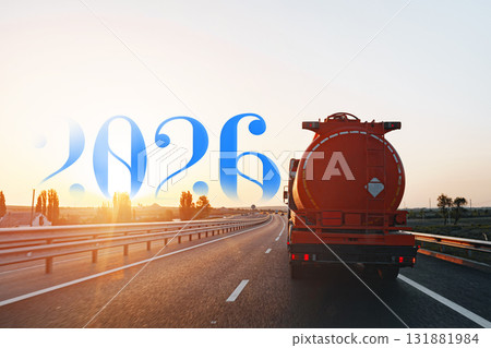 Transport truck driving on highway at sunset in 2026 131881984