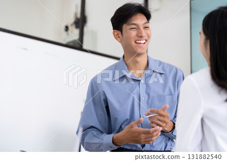 Professional Engagement and Sustainability. An engineer sharing ideas with a colleague about sustainable engineering practices. Professional Engagement and Sustainability. An engineer sharing ideas with a colleague about sustainable engineering practices. 131882540