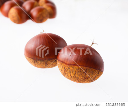 Chestnuts on a white background Chestnuts on a white background 131882665