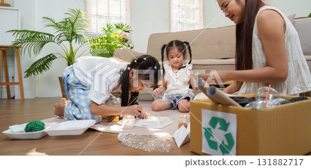 Sustainable Play and Recycling Fun. Children engaging in creative recycling activities while learning about sustainability. 131882717