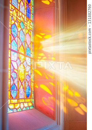 Colorful Stained Glass Window with Sunlight Casting Patterns on Wall. Colorful Stained Glass Window with Sunlight Casting Patterns on Wall. 131882760