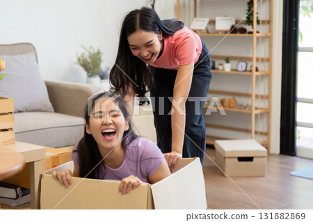 LGBT Couple and Home Adventure. A fun-loving pair engaging in playful antics while moving into their new home. LGBT Couple and Home Adventure. A fun-loving pair engaging in playful antics while moving into their new home. 131882869