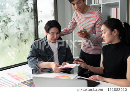 Design Review and Team Synergy. A team evaluating design concepts and sharing feedback in a collaborative setting. Design Review and Team Synergy. A team evaluating design concepts and sharing feedback in a collaborative setting. 131882910