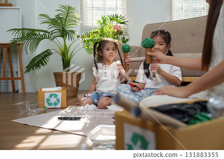 Creative Expression and Green Living. Kids exploring imaginative recycling with fun projects. 131883355