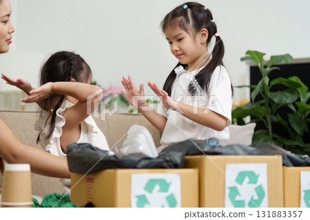 Eco-friendly Practices and Fun. Children learning about recycling through playful interaction. Eco-friendly Practices and Fun. Children learning about recycling through playful interaction. 131883357