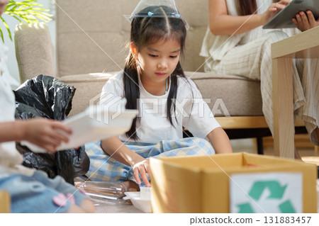 Sustainable Crafts and Environmental Education. Children learning to recycle materials creatively while engaging in eco-friendly crafts. 131883457