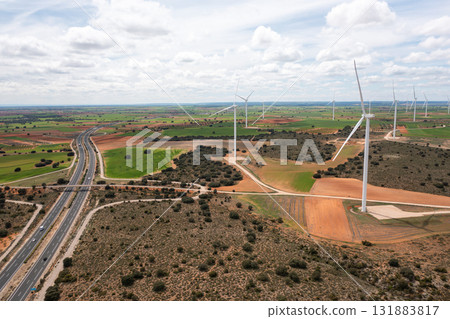 Aerial drone view of wind turbines on open fields Aerial drone view of wind turbines on open fields 131883817