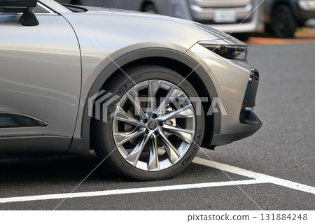 Image of a sedan in a parking lot Image of a sedan in a parking lot 131884248