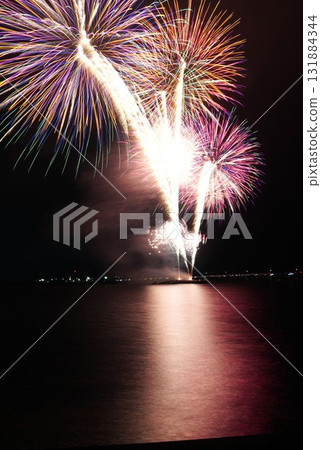 Fireworks over the lake coloring the night sky - Scenes from the Kashima City Fireworks Festival 131884344