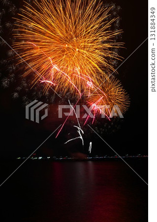 Fireworks over the lake coloring the night sky - Scenes from the Kashima City Fireworks Festival 131884349