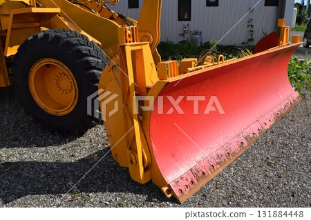 Snowplow waiting in a snowy country Snowplow waiting in a snowy country 131884448