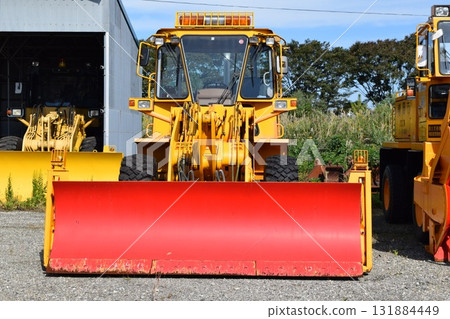 Snowplow waiting in a snowy country Snowplow waiting in a snowy country 131884449