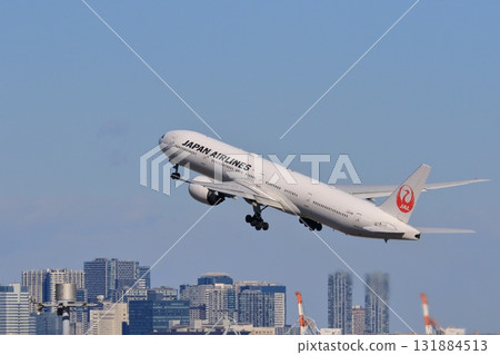 Passenger plane taking off and climbing Passenger plane taking off from Haneda Airport 131884513