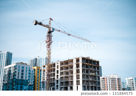 Construction crane in the construction of multi-storey buildings. High quality photo 131884575