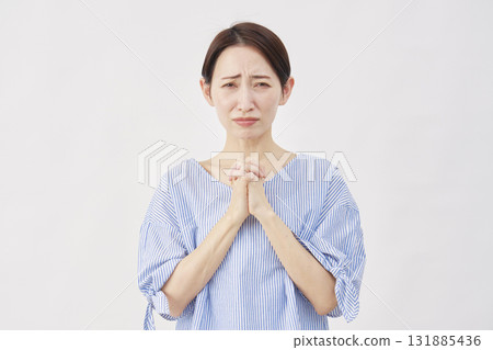 Woman, middle-aged, pleading, white background, looking at camera 131885436
