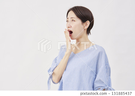 Woman middle-aged yawning white background 131885437