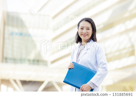 Smiley female doctor Smiley female doctor 131885691