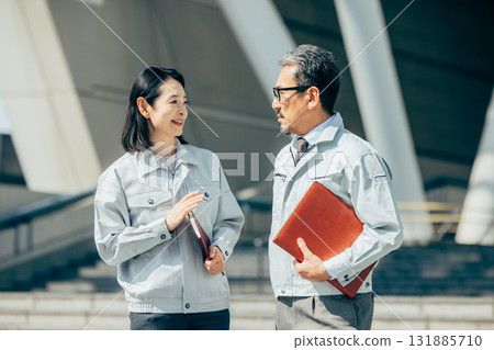 Senior men and women in work clothes 131885710