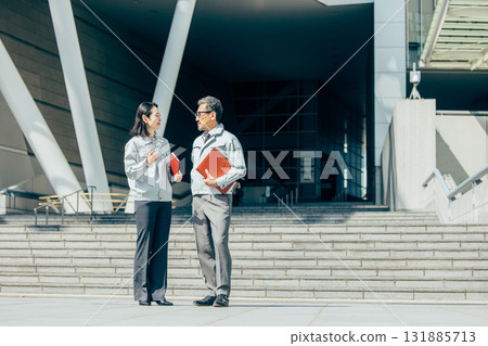 Senior men and women in work clothes Senior men and women in work clothes 131885713