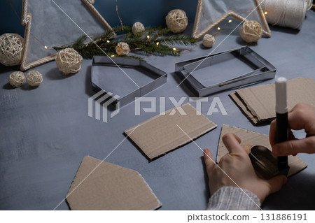 Cardboard Lantern handmade house Storytelling creating craft Christmas holiday decoration. Tactile hand-on activity. Master class progress of creative me-made gifts. Seasonal domestic life micro 131886191