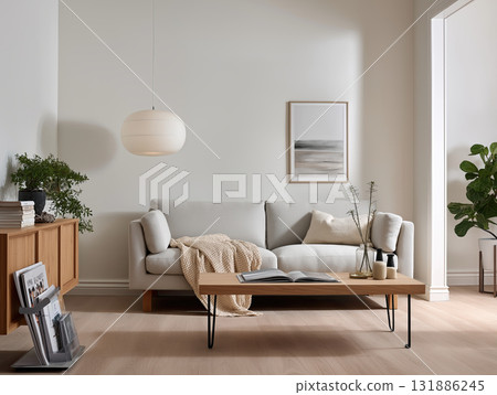 Soft neutral living room with modern sofa, wooden coffee table, textured throw and minimalist decor creating calm, cozy and elegant atmosphere for relaxing or reading 131886245