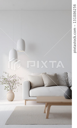 Minimal white living room with modern pendant light, neutral sofa, textured throw pillow and wooden coffee table creating calm and airy interior 131886256