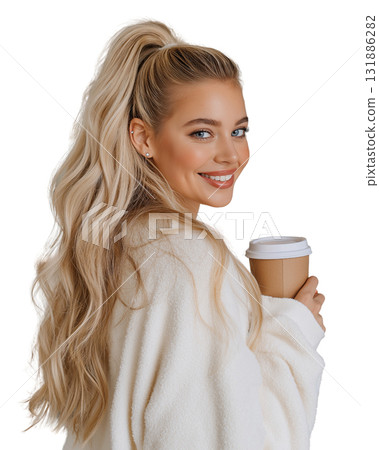 Young woman with long blonde hair wearing cozy sweater holding takeaway coffee cup smiling warmly 131886282