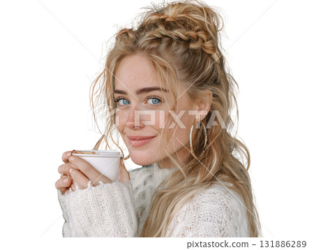 Young woman with blue eyes freckled skin holding hot drink in cozy knit sweater, smiling warmly with braided hairstyle and hoop earring Young woman with blue eyes freckled skin holding hot drink in cozy knit sweater, smiling warmly with braided hairstyle and hoop earring 131886289