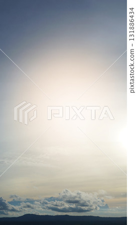 Vertical view of nature silhouette dark mountain up to the sky and gold sky. Free space for general use for insert concept subject. Vertical view of nature silhouette dark mountain up to the sky and gold sky. Free space for general use for insert concept subject. 131886434