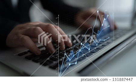 Hands Typing on Laptop with Financial Data and Graphs Displayed, Representing Business Growth and Technology in Modern Workspace Scalp Hands Typing on Laptop with Financial Data and Graphs Displayed, Representing Business Growth and Technology in Modern Workspace Scalp 131887447