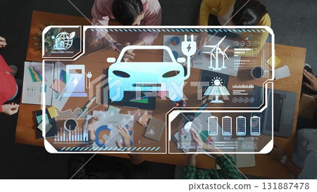 Top View of Diverse Team Collaborating on Electric Vehicle Development with Digital Overlays and Innovative Technology Visuals. Raster 131887478