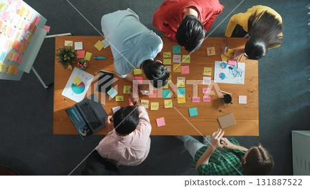 Top view of manager working while team support her performance. Convocation. Top view of manager working while team support her performance. Convocation. 131887522