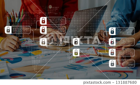Diverse team collaborating on cybersecurity project with laptop and colorful charts, emphasizing teamwork and data protection concepts. Raster 131887680