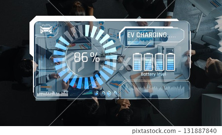 EV Charging Status Display on Digital Screen in Modern Office with Business Team Discussing Electric Vehicle Technology Developments and Innovations. Raster EV Charging Status Display on Digital Screen in Modern Office with Business Team Discussing Electric Vehicle Technology Developments and Innovations. Raster 131887840