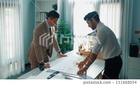 Top view of smart engineer team talking about house construction. Alimentation. 131888054