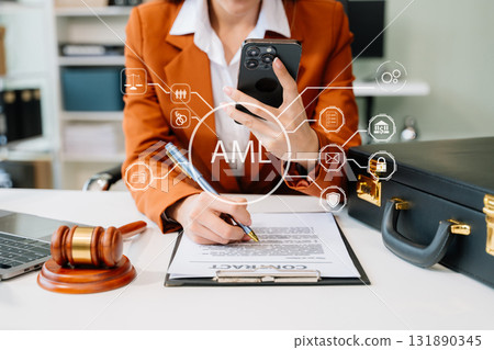 AML Anti Money Laundering Financial Bank Business Concept. judge in a courtroom using laptop and tablet with AML 131890345