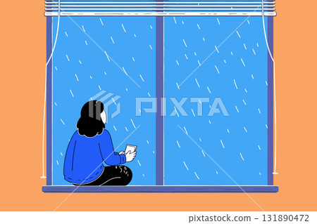 Girl watching rain with phone 131890472