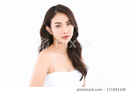 A beautiful young Asian woman with clean, fresh skin against a white background. Skincare, facial treatment, cosmetology, beauty, and spa. An elegant portrait of an Asian woman. A beautiful young Asian woman with clean, fresh skin against a white background. Skincare, facial treatment, cosmetology, beauty, and spa. An elegant portrait of an Asian woman. 131891106