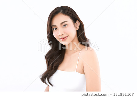 A beautiful young Asian woman with clean, fresh skin against a white background. Skincare, facial treatment, cosmetology, beauty, and spa. An elegant portrait of an Asian woman. A beautiful young Asian woman with clean, fresh skin against a white background. Skincare, facial treatment, cosmetology, beauty, and spa. An elegant portrait of an Asian woman. 131891107