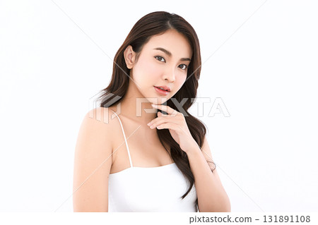 A beautiful young Asian woman with clean, fresh skin against a white background. Skincare, facial treatment, cosmetology, beauty, and spa. An elegant portrait of an Asian woman. A beautiful young Asian woman with clean, fresh skin against a white background. Skincare, facial treatment, cosmetology, beauty, and spa. An elegant portrait of an Asian woman. 131891108