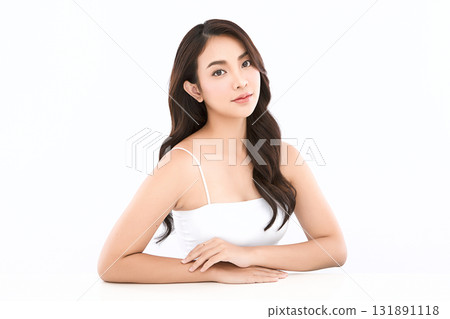 A beautiful young Asian woman with clean, fresh skin against a white background. Skincare, facial treatment, cosmetology, beauty, and spa. An elegant portrait of an Asian woman. A beautiful young Asian woman with clean, fresh skin against a white background. Skincare, facial treatment, cosmetology, beauty, and spa. An elegant portrait of an Asian woman. 131891118